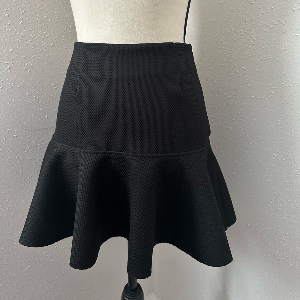 H&M Black Mini peplum skirt. Size 6.